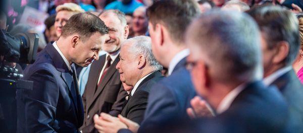 Andrzej Duda, and Jaroslaw Kaczynski (C) seen shaking hands during a party convection in Warsaw, February 7, 2015. Andrzej Duda, and Jaroslaw Kaczynski (C) seen shaking hands during a party convection in Warsaw, February 7, 2015. - Sputnik International