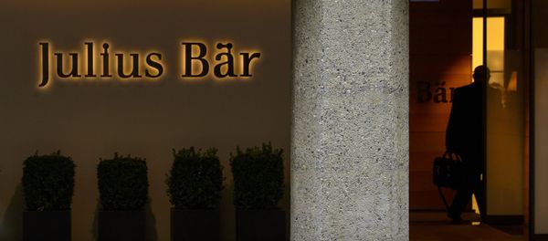 A man enters the Swiss private banking group Julius Baer headquarters on September 24, 2012 in Zurich A man enters the Swiss private banking group Julius Baer headquarters on September 24, 2012 in Zurich - Sputnik International
