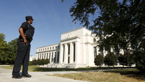 A Federal Reserve police officer keeps watch while posted outside the Federal Reserve headquarters in Washington September 16, 2015 A Federal Reserve police officer keeps watch while posted outside the Federal Reserve headquarters in Washington September 16, 2015 - Sputnik International