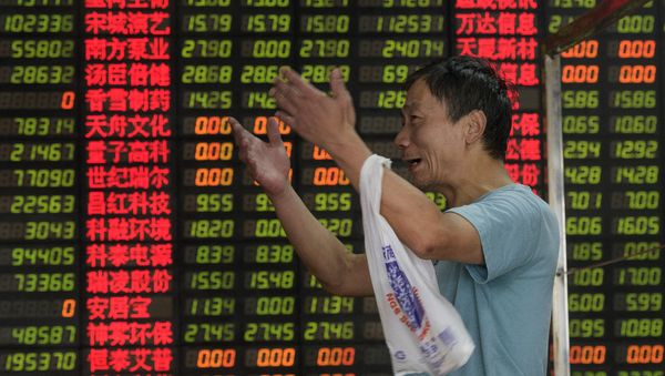 In this file picture taken on September 1, 2015, an investor reacts in front of screens showing stock market movements at a brokerage house in Shanghay In this file picture taken on September 1, 2015, an investor reacts in front of screens showing stock market movements at a brokerage house in Shanghay - Sputnik International