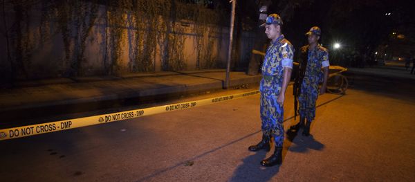 Bangladeshi police officers stand guard on September 28, 2015 at the site where an Italian charity worker has died after being shot by attackers in Dhaka Bangladeshi police officers stand guard on September 28, 2015 at the site where an Italian charity worker has died after being shot by attackers in Dhaka - Sputnik International