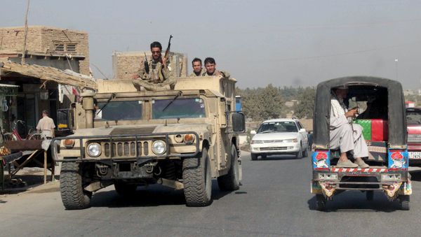 Afghan security forces travel on an armored vehicle in Kunduz Province, Afghanistan September 28, 2015 Afghan security forces travel on an armored vehicle in Kunduz Province, Afghanistan September 28, 2015 - Sputnik International