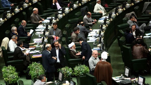 Iranian members of parliament attend a parliamentary session in Tehran on June 23, 2015 Iranian members of parliament attend a parliamentary session in Tehran on June 23, 2015 - Sputnik International