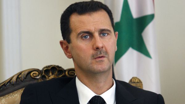 FILE - This Aug. 19, 2009 file photo shows Syrian President Bashar Assad during a meeting with his Iranian counterpart Mahmoud Ahmadinejad in Tehran, Iran - Sputnik International