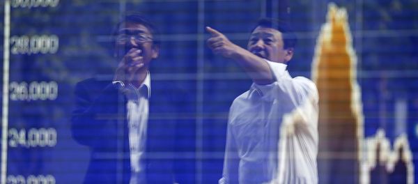 Tokyo businessmen react as they are reflected on a graph showing recent movements of Shanghai Stock Exchange B share index outside a brokerage in Tokyo, Japan, September 29, 2015 Tokyo businessmen react as they are reflected on a graph showing recent movements of Shanghai Stock Exchange B share index outside a brokerage in Tokyo, Japan, September 29, 2015 - Sputnik International