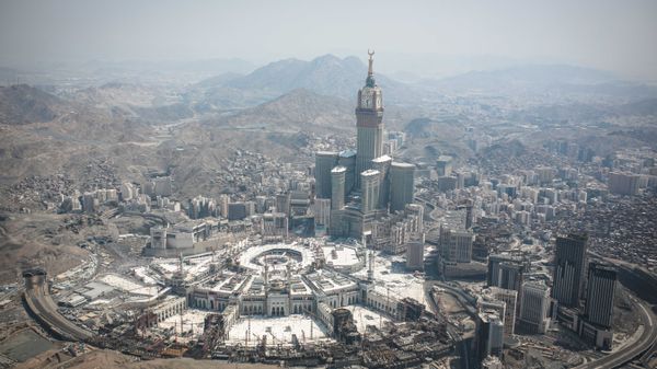 In this aerial photo made from a helicopter, the Abraj Al-Bait Towers with the four-faced clocks stands over the holy Kaaba, as Muslims encircle it inside the Grand Mosque, during the annual pilgrimage known as the hajj, in the Muslim holy city of Mecca, Saudi Arabia, Friday, Sept. 25, 2015. In this aerial photo made from a helicopter, the Abraj Al-Bait Towers with the four-faced clocks stands over the holy Kaaba, as Muslims encircle it inside the Grand Mosque, during the annual pilgrimage known as the hajj, in the Muslim holy city of Mecca, Saudi Arabia, Friday, Sept. 25, 2015. - Sputnik International