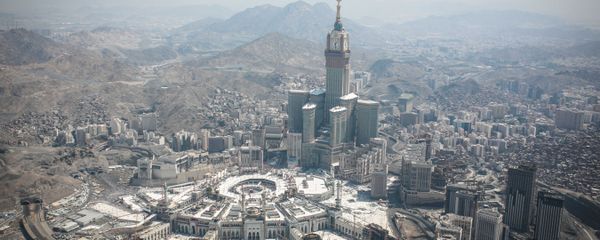 In this aerial photo made from a helicopter, the Abraj Al-Bait Towers with the four-faced clocks stands over the holy Kaaba, as Muslims encircle it inside the Grand Mosque, during the annual pilgrimage known as the hajj, in the Muslim holy city of Mecca, Saudi Arabia, Friday, Sept. 25, 2015. In this aerial photo made from a helicopter, the Abraj Al-Bait Towers with the four-faced clocks stands over the holy Kaaba, as Muslims encircle it inside the Grand Mosque, during the annual pilgrimage known as the hajj, in the Muslim holy city of Mecca, Saudi Arabia, Friday, Sept. 25, 2015. - Sputnik International