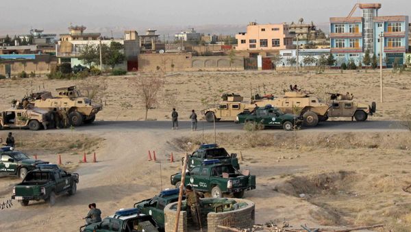 Afghan security forces take their positions during a gun battle in Kunduz city, northern Afghanistan September 29, 2015 Afghan security forces take their positions during a gun battle in Kunduz city, northern Afghanistan September 29, 2015 - Sputnik International