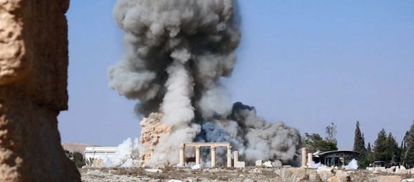This undated photo released Tuesday, Aug. 25, 2015, file photo, on a social media site used by Islamic State militants, which has been verified and is consistent with other AP reporting, shows smoke from the detonation of the 2,000-year-old temple of Baalshamin in Syria's ancient caravan city of Palmyra This undated photo released Tuesday, Aug. 25, 2015, file photo, on a social media site used by Islamic State militants, which has been verified and is consistent with other AP reporting, shows smoke from the detonation of the 2,000-year-old temple of Baalshamin in Syria's ancient caravan city of Palmyra - Sputnik International