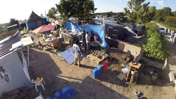 An aerial view shows tents and shelters at the makeshift camp called The New Jungle in Calais, France, September 20, 2015 An aerial view shows tents and shelters at the makeshift camp called The New Jungle in Calais, France, September 20, 2015 - Sputnik International