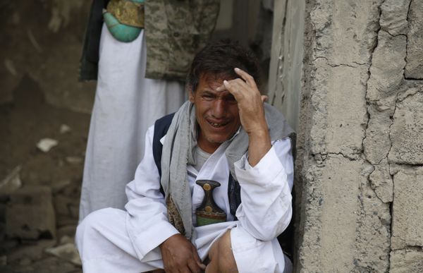 A man cries after some of his relatives were killed in a Saudi-led airstrike in Sanaa, Yemen, Monday, Sept. 21, 2015. - Sputnik International
