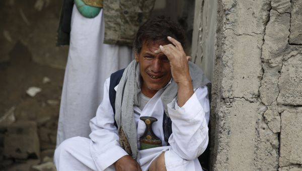 A man cries after some of his relatives were killed in a Saudi-led airstrike in Sanaa, Yemen, Monday, Sept. 21, 2015. A man cries after some of his relatives were killed in a Saudi-led airstrike in Sanaa, Yemen, Monday, Sept. 21, 2015. - Sputnik International