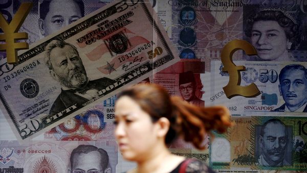 A woman walks past a money exchange shop in Kuala Lumpur, Malaysia, in this August 25, 2015 file photo A woman walks past a money exchange shop in Kuala Lumpur, Malaysia, in this August 25, 2015 file photo - Sputnik International
