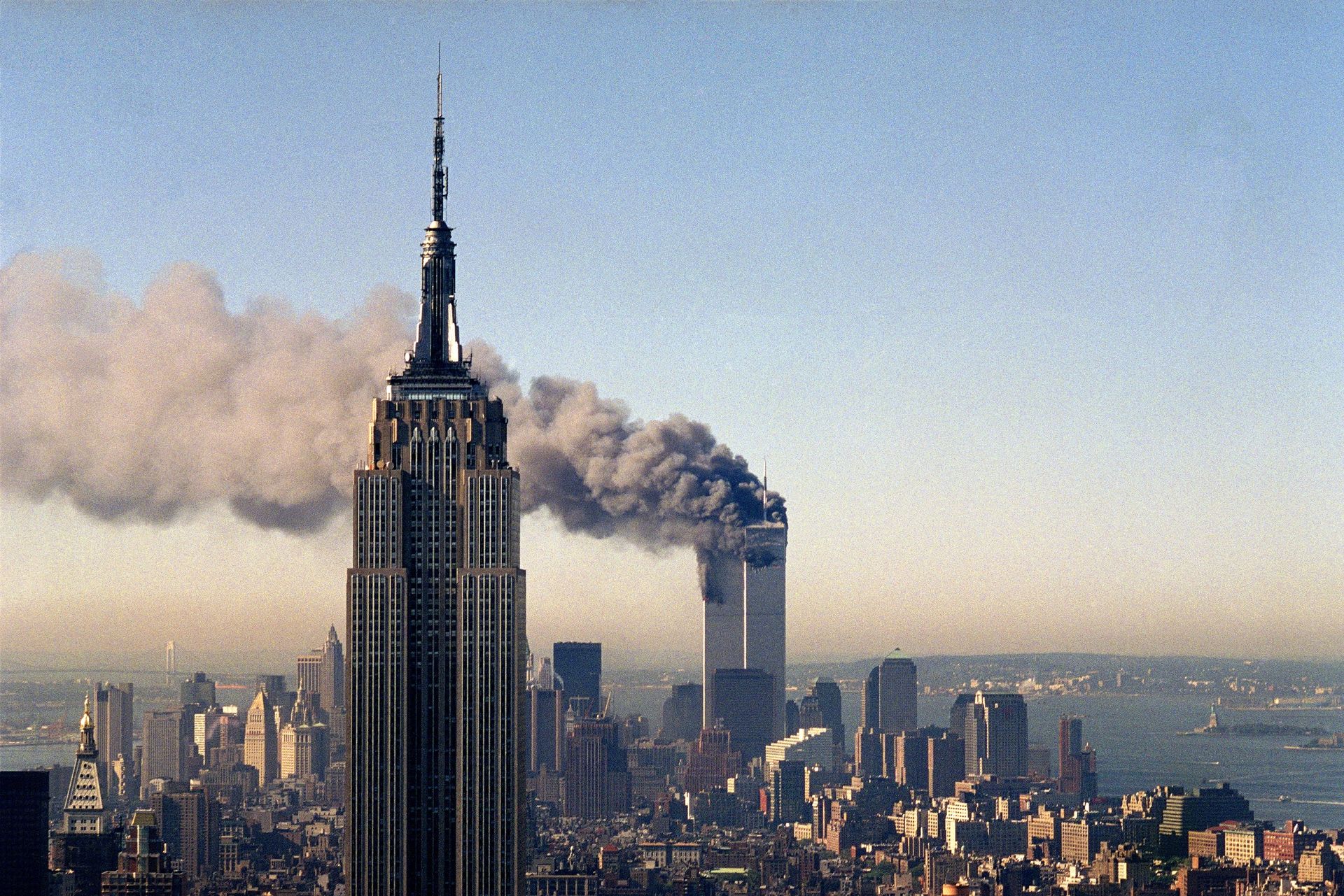In this Sept. 11, 2001, file photo, the twin towers of the World Trade Center burn behind the Empire State Building in New York. In this Sept. 11, 2001, file photo, the twin towers of the World Trade Center burn behind the Empire State Building in New York. - Sputnik International, 1920, 10.09.2021