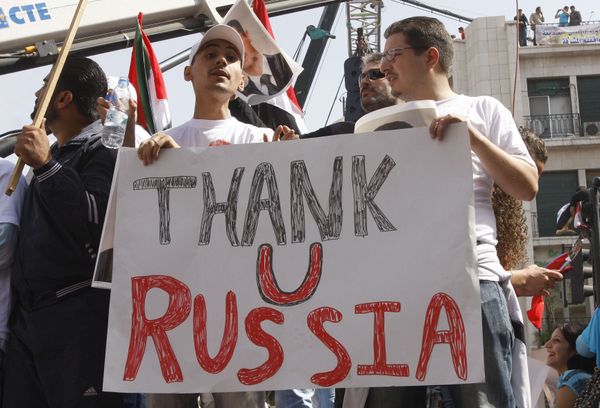 In this Oct. 12, 2011 file photo, supporters of the Syrian government hold a pro-Russian banner to show their support for President Bashar Assad and to thank Russia and China for blocking a U.N. Security Council resolution condemning Syria for its brutal crackdown, during a demonstration in Damascus, Syria.  - Sputnik International