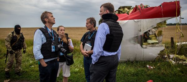A search-and-rescue operation on the site of the MH17 plane crash in Ukraine's Donetsk region. File photo - Sputnik International