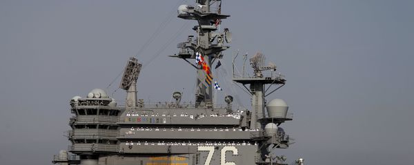 The crew members of the USS Ronald Reagan, a Nimitz-class nuclear-powered super carrier, stand at attention as it arrives at the U.S. naval base in Yokosuka, south of Tokyo, Japan The crew members of the USS Ronald Reagan, a Nimitz-class nuclear-powered super carrier, stand at attention as it arrives at the U.S. naval base in Yokosuka, south of Tokyo, Japan - Sputnik International