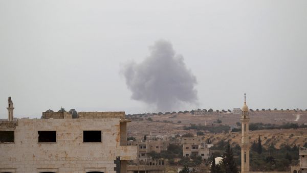 Smoke rises from a base controlled by rebel fighters from the Ahrar al-Sham Movement, that was targeted by what activists said were Russian airstrikes at Hass ancient cemeteries in the southern countryside of Idlib, Syria October 1, 2015. Smoke rises from a base controlled by rebel fighters from the Ahrar al-Sham Movement, that was targeted by what activists said were Russian airstrikes at Hass ancient cemeteries in the southern countryside of Idlib, Syria October 1, 2015. - Sputnik International