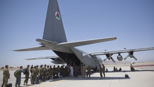 In this Tuesday, Aug. 18, 2015 photo, Afghan National Army soldiers line up to get into a C-130 Hercules, at Kandahar Air Base, in Kandahar, Afghanistan. In this Tuesday, Aug. 18, 2015 photo, Afghan National Army soldiers line up to get into a C-130 Hercules, at Kandahar Air Base, in Kandahar, Afghanistan. - Sputnik International