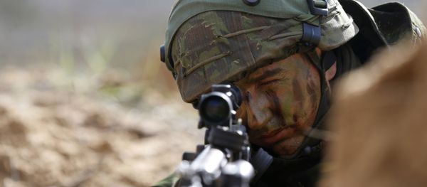 Members of the Lithuania Army Mechanised Infantry Brigade Iron Wolf seen during a military exercise 'Black Arrow 2014' at the Rukla military base some 120 kms (75 miles) west of the capital Vilnius, Lithuania, Wednesday, May 14, 2014. - Sputnik International
