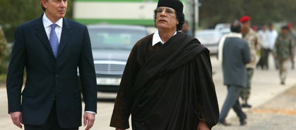 Libyan leader Col. Moammar Gadhafi, at right, with Britain's Prime Minister Tony Blair as they meet outside Tripoli, in Libya, Thursday, March, 25, 2004. Libyan leader Col. Moammar Gadhafi, at right, with Britain's Prime Minister Tony Blair as they meet outside Tripoli, in Libya, Thursday, March, 25, 2004. - Sputnik International