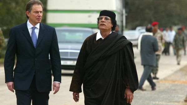 Libyan leader Col. Moammar Gadhafi, at right, with Britain's Prime Minister Tony Blair as they meet outside Tripoli, in Libya, Thursday, March, 25, 2004. Libyan leader Col. Moammar Gadhafi, at right, with Britain's Prime Minister Tony Blair as they meet outside Tripoli, in Libya, Thursday, March, 25, 2004. - Sputnik International