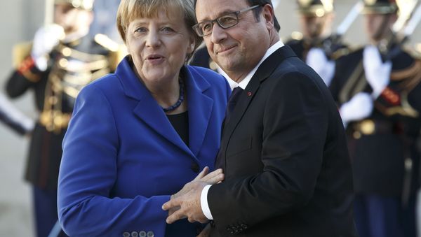 German Chancellor Angela Merkel , left, is welcomed by French President Francois Hollande at the Elysee Palace in Paris, France, Friday, Oct. 2, 2015. German Chancellor Angela Merkel , left, is welcomed by French President Francois Hollande at the Elysee Palace in Paris, France, Friday, Oct. 2, 2015. - Sputnik International