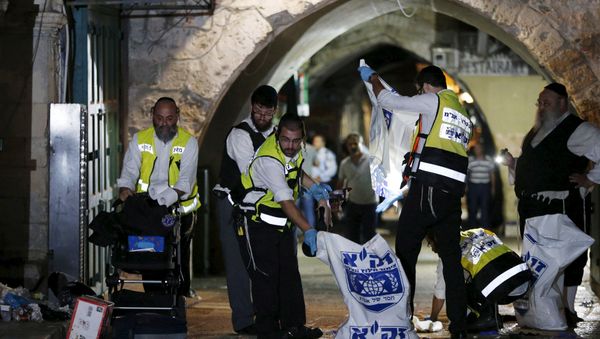 Members of the Zaka Rescue and Recovery team clean the scene where a Palestinian was shot dead after he stabbed and killed two people in Jerusalem's Old City October 3, 2015 Members of the Zaka Rescue and Recovery team clean the scene where a Palestinian was shot dead after he stabbed and killed two people in Jerusalem's Old City October 3, 2015 - Sputnik International