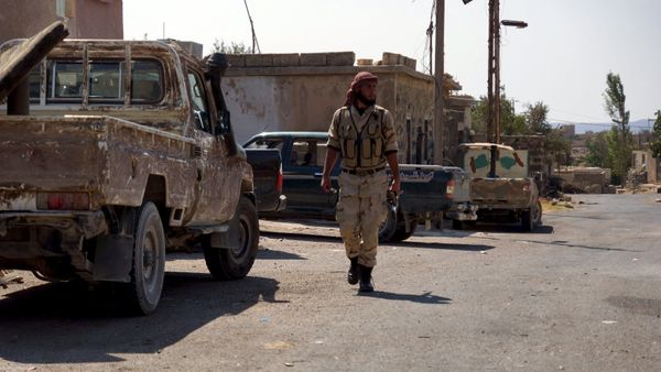 A Free Syrian Army fighter walks near military vehicles during what they said was preparations for an operation to strike at forces loyal to Syria's president Bashar Al-Assad in order to break a siege on the city of Beit Gin located in western countryside of Damascus in Deraa, Syria September 30, 2015 A Free Syrian Army fighter walks near military vehicles during what they said was preparations for an operation to strike at forces loyal to Syria's president Bashar Al-Assad in order to break a siege on the city of Beit Gin located in western countryside of Damascus in Deraa, Syria September 30, 2015 - Sputnik International