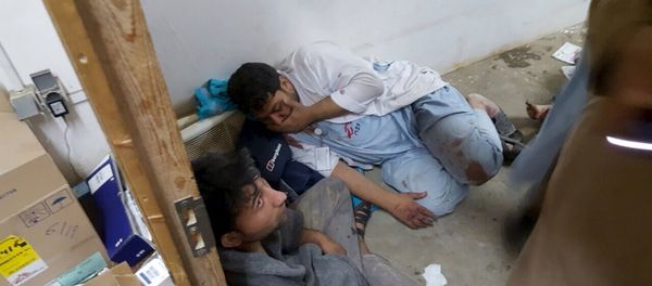 Afghan staff react inside a Medecins Sans Frontieres (MSF) hospital after an air strike in the city of Kunduz, Afghanistan in this October 3, 2015 - Sputnik International
