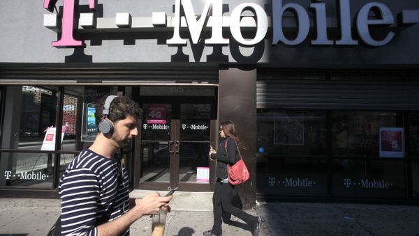 In this Sept. 12, 2012 file photo, a man uses a cellphone as he passes a T-Mobile store in New York. In this Sept. 12, 2012 file photo, a man uses a cellphone as he passes a T-Mobile store in New York. - Sputnik International