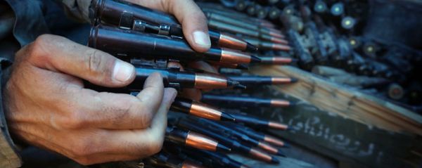 A fighter prepares an ammunition belt. A fighter prepares an ammunition belt. - Sputnik International