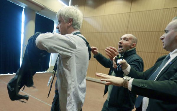 Air France assistant director long-haul flight, Pierre Plissonnier, left, is protected by security guards as he flees the Air France headquarters at Roissy Airport, north of Paris, France, after scuffles with union activists. Monday, Oct. 5, 2015. Union activists protesting proposed layoffs at Air France stormed the headquarters during a meeting about the job cuts, zeroing in on two managers who had their shirts torn from their bodies, scaled a fence and fled under police protection. Air France assistant director long-haul flight, Pierre Plissonnier, left, is protected by security guards as he flees the Air France headquarters at Roissy Airport, north of Paris, France, after scuffles with union activists. Monday, Oct. 5, 2015. Union activists protesting proposed layoffs at Air France stormed the headquarters during a meeting about the job cuts, zeroing in on two managers who had their shirts torn from their bodies, scaled a fence and fled under police protection. - Sputnik International