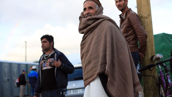 Afghan migrants stand in the Jungle of Calais, northern France, Friday, Sept. 18, 2015. Afghan migrants stand in the Jungle of Calais, northern France, Friday, Sept. 18, 2015. - Sputnik International
