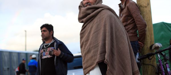 Afghan migrants stand in the Jungle of Calais, northern France, Friday, Sept. 18, 2015. Afghan migrants stand in the Jungle of Calais, northern France, Friday, Sept. 18, 2015. - Sputnik International