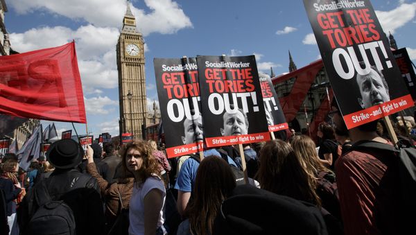 Protesters demonstrate against the Conservative government in Westminster, London, Saturday, May 9, 2015. David Cameron's Conservative Party swept to power Friday in Britain's Parliamentary General Elections, winning an unexpected majority. Protesters demonstrate against the Conservative government in Westminster, London, Saturday, May 9, 2015. David Cameron's Conservative Party swept to power Friday in Britain's Parliamentary General Elections, winning an unexpected majority. - Sputnik International
