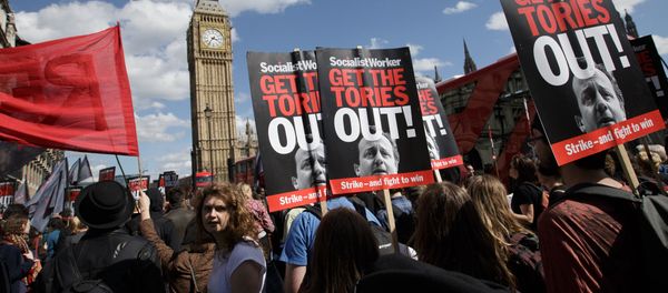 Protesters demonstrate against the Conservative government in Westminster, London, Saturday, May 9, 2015. David Cameron's Conservative Party swept to power Friday in Britain's Parliamentary General Elections, winning an unexpected majority. Protesters demonstrate against the Conservative government in Westminster, London, Saturday, May 9, 2015. David Cameron's Conservative Party swept to power Friday in Britain's Parliamentary General Elections, winning an unexpected majority. - Sputnik International