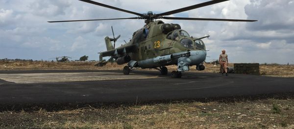 Ground crew servicing a Russian Mi-24 helicopter in Syria's Hmeymim airbase. Ground crew servicing a Russian Mi-24 helicopter in Syria's Hmeymim airbase. - Sputnik International
