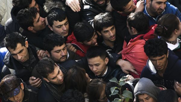 Migrants and refugees crowd in a line as they wait for their registration at central registration center for refugees and asylum seekers LaGeSo (Landesamt fuer Gesundheit und Soziales - State Office for Health and Social Affairs) in Berlin, Germany, Thursday, Oct. 1, 2015. Migrants and refugees crowd in a line as they wait for their registration at central registration center for refugees and asylum seekers LaGeSo (Landesamt fuer Gesundheit und Soziales - State Office for Health and Social Affairs) in Berlin, Germany, Thursday, Oct. 1, 2015. - Sputnik International