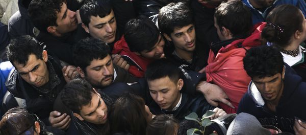 Migrants and refugees crowd in a line as they wait for their registration at central registration center for refugees and asylum seekers LaGeSo (Landesamt fuer Gesundheit und Soziales - State Office for Health and Social Affairs) in Berlin, Germany, Thursday, Oct. 1, 2015. Migrants and refugees crowd in a line as they wait for their registration at central registration center for refugees and asylum seekers LaGeSo (Landesamt fuer Gesundheit und Soziales - State Office for Health and Social Affairs) in Berlin, Germany, Thursday, Oct. 1, 2015. - Sputnik International