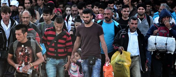 Refugees and migrants disembark from a ferry from Lesbos island in the port of Piraeus on October 6, 2015. Some 7000 migrants and refugees are expected to arrive to the port of Piraeus on October 6, on chartered or line ferries, according to Greek media Refugees and migrants disembark from a ferry from Lesbos island in the port of Piraeus on October 6, 2015. Some 7000 migrants and refugees are expected to arrive to the port of Piraeus on October 6, on chartered or line ferries, according to Greek media - Sputnik International