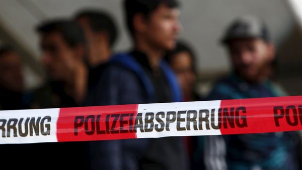 Migrants wait at a meadow near Breitenberg, south eastern Germany, October 5, 2015, before the German police will bring them to a first registration point in Passau. - Sputnik International
