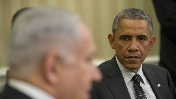 President Barack Obama listens as Israeli Prime Minister Benjamin Netanyahu speaks during their meeting in the Oval Office of the White House in Washington, Wednesday, Oct. 1, 2014. President Barack Obama and Israeli Prime Minister Benjamin Netanyahu met for the first time since a rash of civilian casualties during Israel's summer war with Hamas heightened tensions between two leaders who have long had a prickly relationship. President Barack Obama listens as Israeli Prime Minister Benjamin Netanyahu speaks during their meeting in the Oval Office of the White House in Washington, Wednesday, Oct. 1, 2014. President Barack Obama and Israeli Prime Minister Benjamin Netanyahu met for the first time since a rash of civilian casualties during Israel's summer war with Hamas heightened tensions between two leaders who have long had a prickly relationship. - Sputnik International