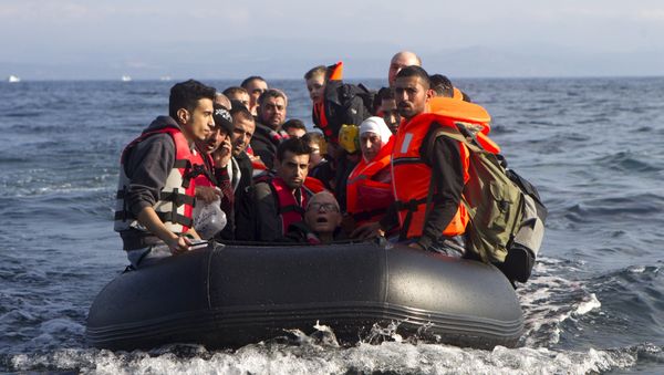 Syrian refugees arrive on an overcrowded dinghy on the Greek island of Lesbos, after crossing a part of the Aegean Sea from the Turkish coast, October 3, 2015 Syrian refugees arrive on an overcrowded dinghy on the Greek island of Lesbos, after crossing a part of the Aegean Sea from the Turkish coast, October 3, 2015 - Sputnik International