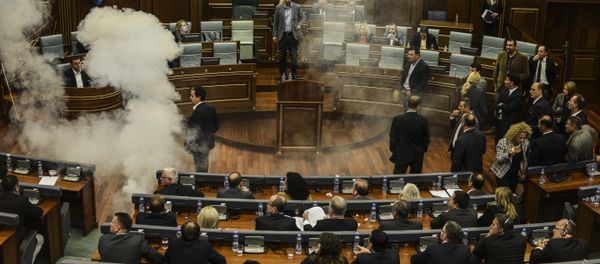 A white cloud of tear gas ascends after being released by opposition lawmakers in Kosovo's parliament in Pristina, on October 8, 2015 causing two MPs to faint, in protest at a recent EU-brokered deal reached by the government with Serbia A white cloud of tear gas ascends after being released by opposition lawmakers in Kosovo's parliament in Pristina, on October 8, 2015 causing two MPs to faint, in protest at a recent EU-brokered deal reached by the government with Serbia - Sputnik International