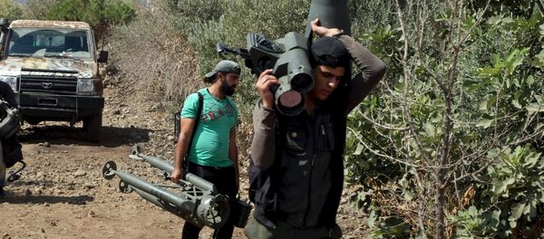 Rebel fighters carry TOW missile launcher outside Damascus suburb, file photo. Rebel fighters carry TOW missile launcher outside Damascus suburb, file photo. - Sputnik International
