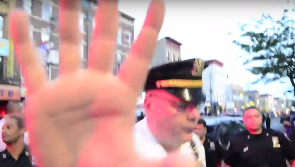 Recording police is protected under the US Constitution’s First Amendment, as long as the person behind the camera is not interfering with an investigation. - Sputnik International