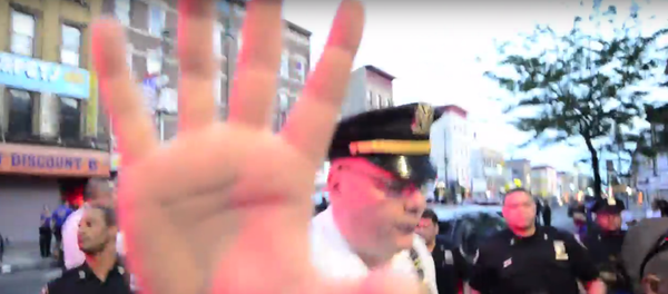 Recording police is protected under the US Constitution’s First Amendment, as long as the person behind the camera is not interfering with an investigation. - Sputnik International
