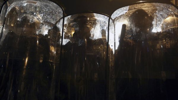 Lebanese riot policemen stand guard on a road leading to the parliament building, during a protest against the trash crisis and government corruption, in downtown Beirut, Lebanon, Thursday, Oct. 8, 2015. Lebanese security forces used water cannons and eventually fired tear gas canisters to disperse dozens of anti-government protesters who tried to get past security barricades and reach parliament. Lebanese riot policemen stand guard on a road leading to the parliament building, during a protest against the trash crisis and government corruption, in downtown Beirut, Lebanon, Thursday, Oct. 8, 2015. Lebanese security forces used water cannons and eventually fired tear gas canisters to disperse dozens of anti-government protesters who tried to get past security barricades and reach parliament. - Sputnik International