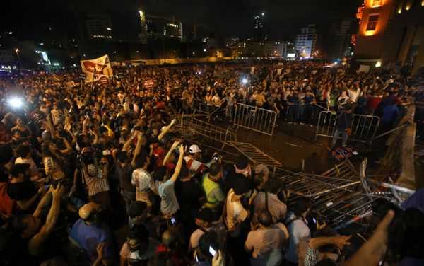 Lebanese anti-government protesters remove barriers that blocked a road linked to the parliament building, during a protest against the ongoing trash crisis and government corruption, in Beirut, Lebanon, on Thursday, Oct. 8, 2015. Lebanese security forces used water cannons and eventually fired tear gas canisters to disperse some dozens of anti-government protesters who tried to get past security barricades and reach parliament. Lebanese anti-government protesters remove barriers that blocked a road linked to the parliament building, during a protest against the ongoing trash crisis and government corruption, in Beirut, Lebanon, on Thursday, Oct. 8, 2015. Lebanese security forces used water cannons and eventually fired tear gas canisters to disperse some dozens of anti-government protesters who tried to get past security barricades and reach parliament. - Sputnik International